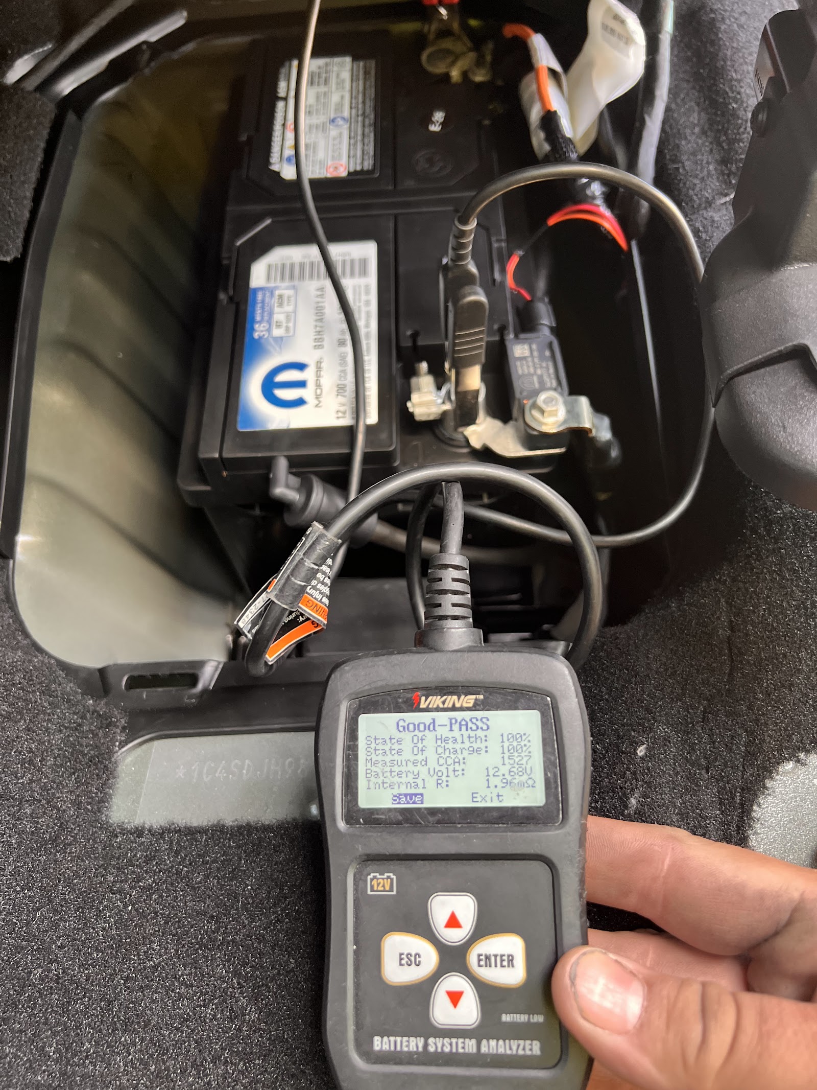 Battery analyzer showing a 'Good-PASS' result after a battery replacement